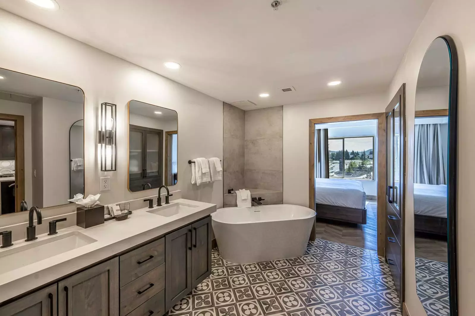 Indulge in luxury with a soaker freestanding tub and upgraded fixtures in our primary bedroom suite