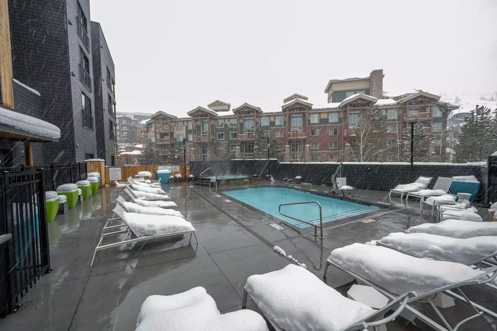 The heated pool has views of the slopes and mountains. The oversized hot tub is the perfect place to rest after you walk to skiing