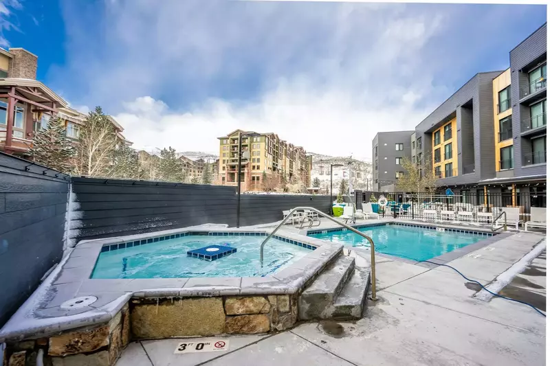 This oversized hot tub and heated pool are located just steps away from the home