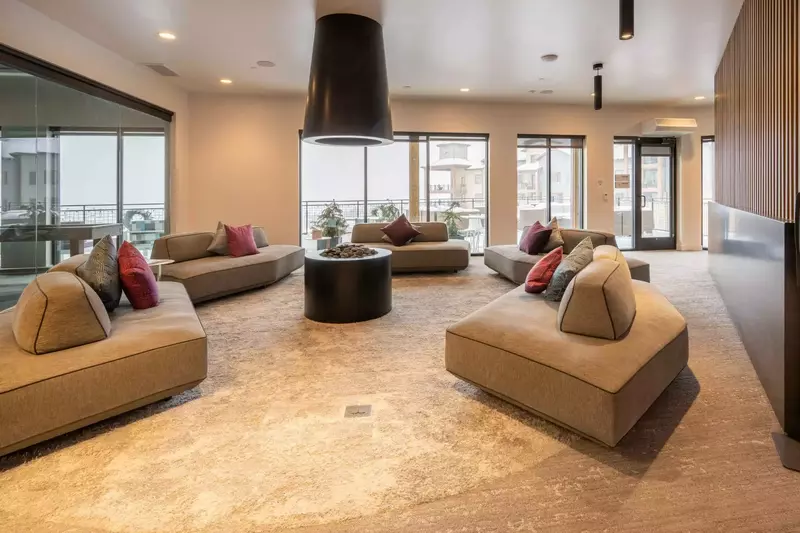 Connect with friends and family while lounging on this modern couch and enjoying the open air fireplace