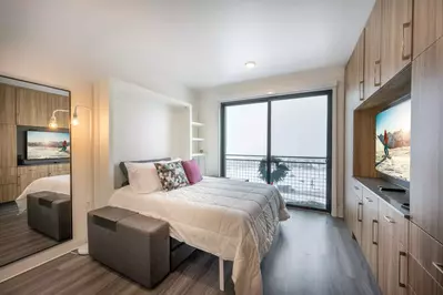 The sofa converts into a comfortable queen sized Murphy bed with professionally cleaned linens.