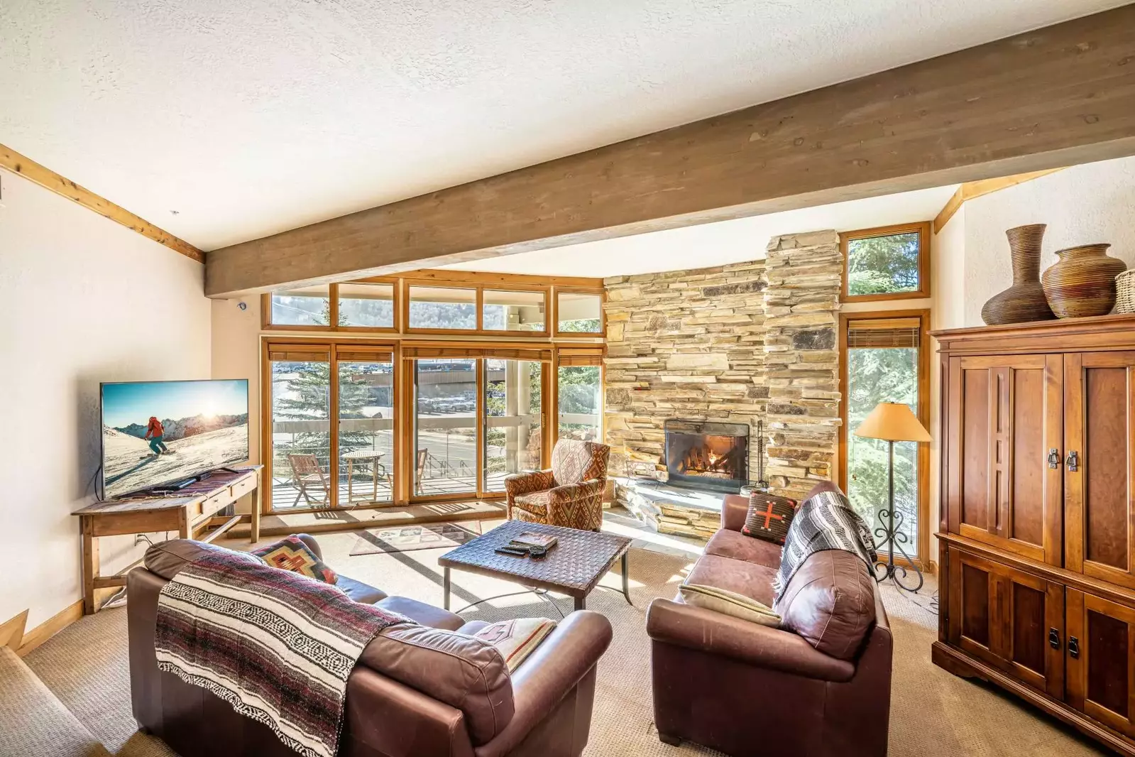 After a long day skiing, guests can walk back and cozy up in the family room with plenty of couches to cuddle up on, a large flat screen TV to watch a