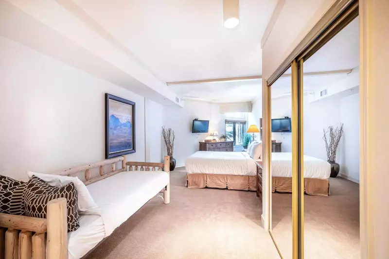 Comfortable Guest bedroom with one queen bed and one twin day bed will surely give you a restful sleep.