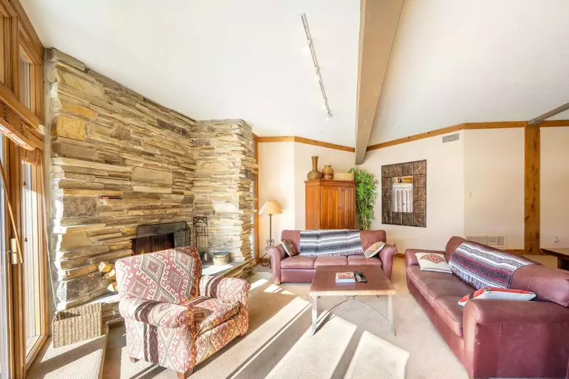 After a long day skiing, guests can walk back and cozy up in the family room with plenty of couches to cuddle up on, with access to the spacious deck.