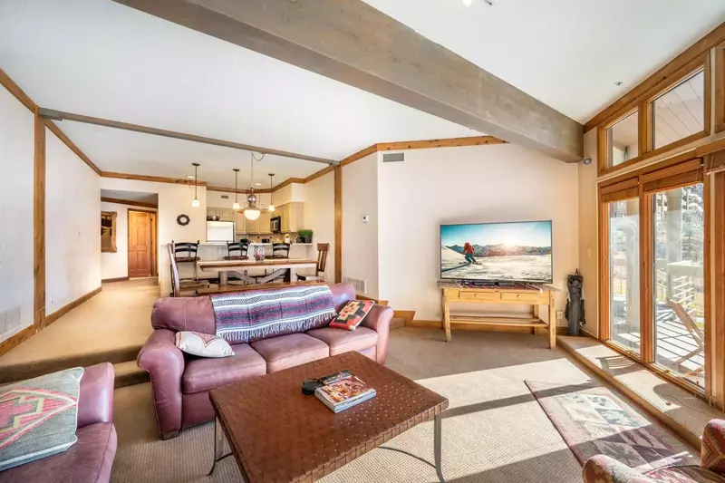 A large chef's kitchen and grand living area provide space for extended family and friends to enjoy the ski season, summer season, or in between.