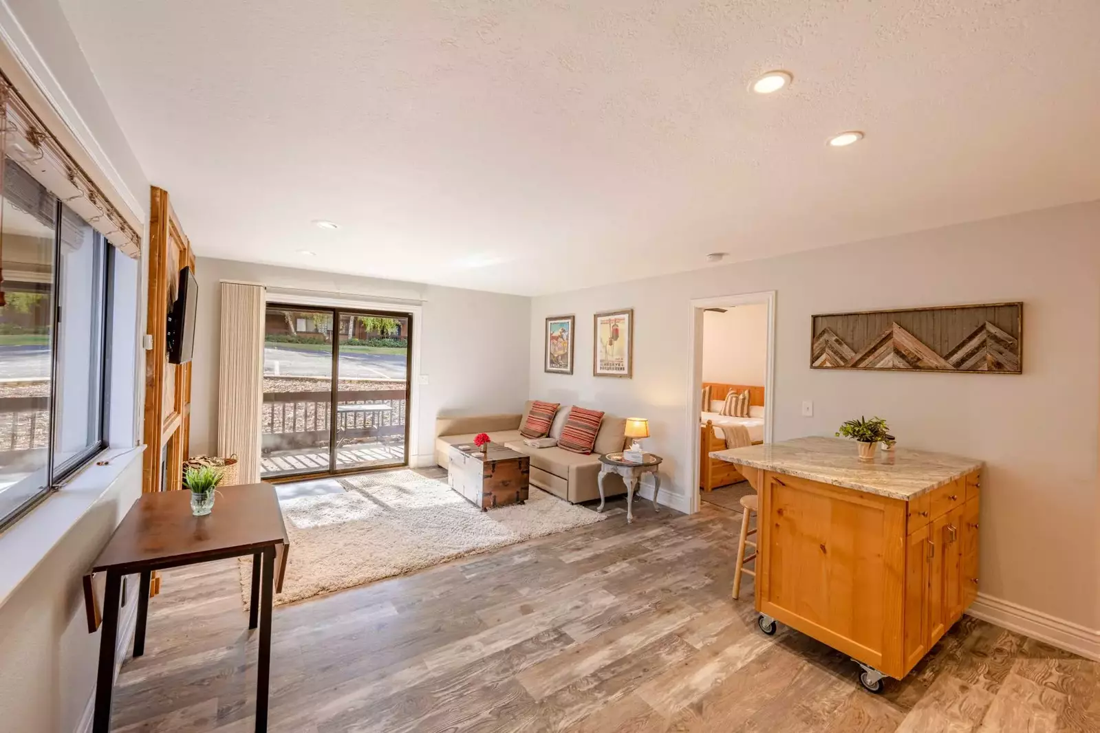 Newly Updated w Hardwood Flooring, Fresh Paint, Comfortable Upholstered Sleeper Sofa, Gas Fireplace, New Smart HDTV, Private Patio!