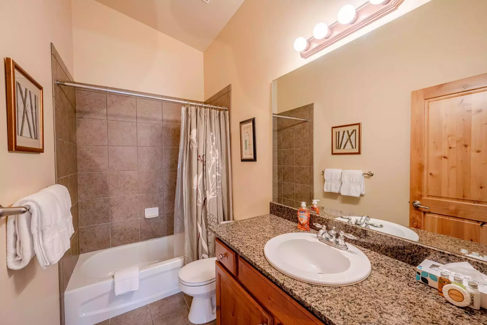 Clean and well maintained third bathroom with shower and bath