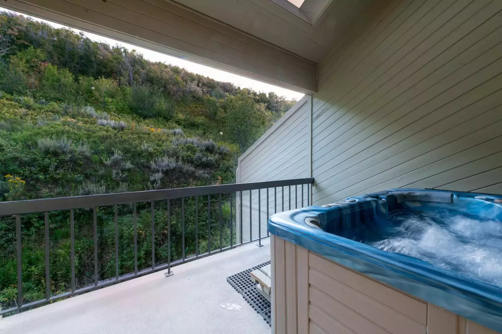 Located on the back deck is the secluded private hot tub. The home was truly built into the mountainside and you can relax knowing there are not other