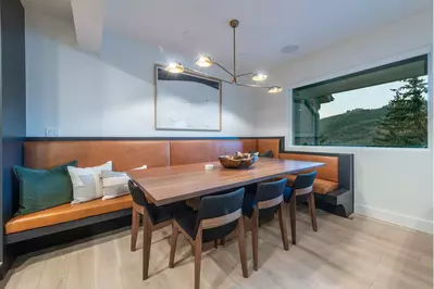 Dining area with custom dining table and banquet