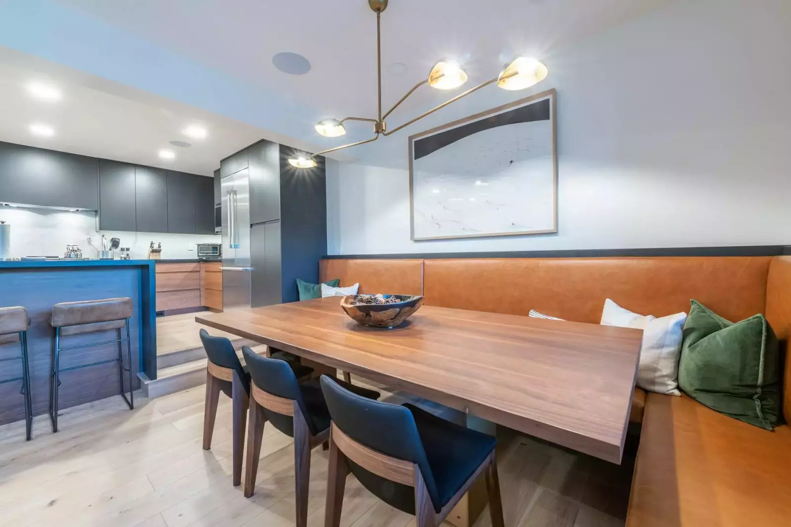 Dining area with custom dining table and banquet that adjoins the living room and kitchen with seating for 8,