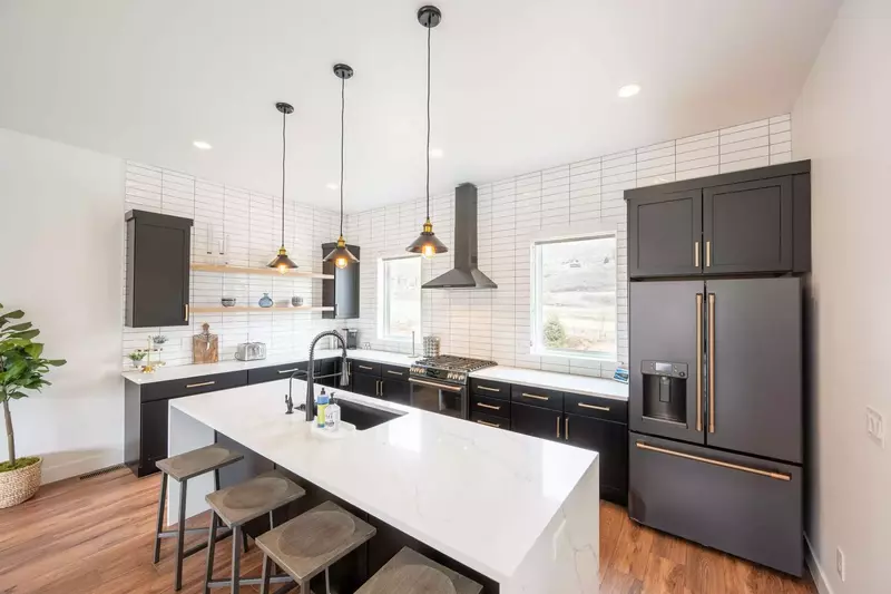 White quartz waterfall edge breakfast bar with additional seating for (4)