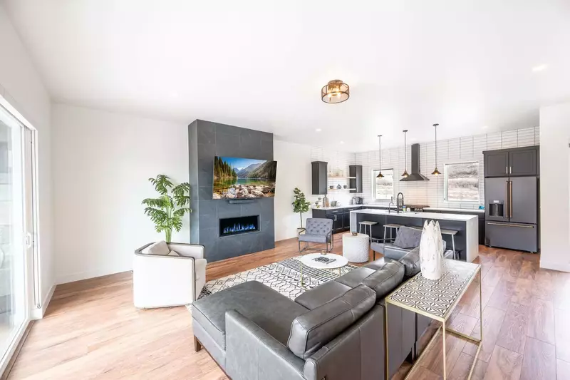 The bright and spacious floor plan features hardwood flooring throughout and invites you upstairs to the main living area.