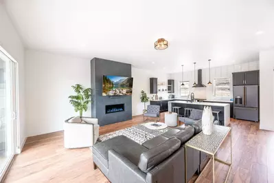 The bright and spacious floor plan features hardwood flooring throughout and invites you upstairs to the main living area.
