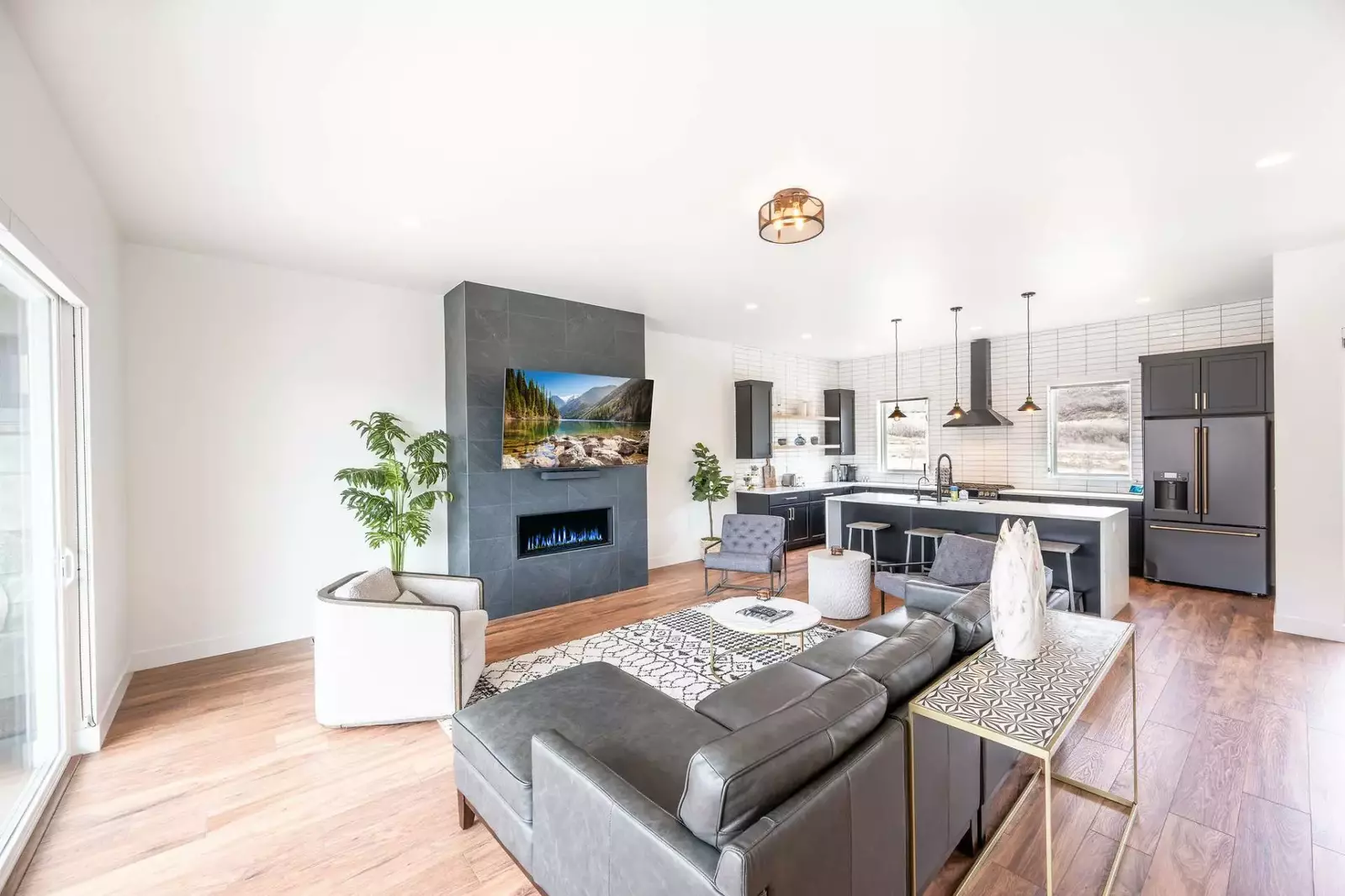 The bright and spacious floor plan features hardwood flooring throughout and invites you upstairs to the main living area.