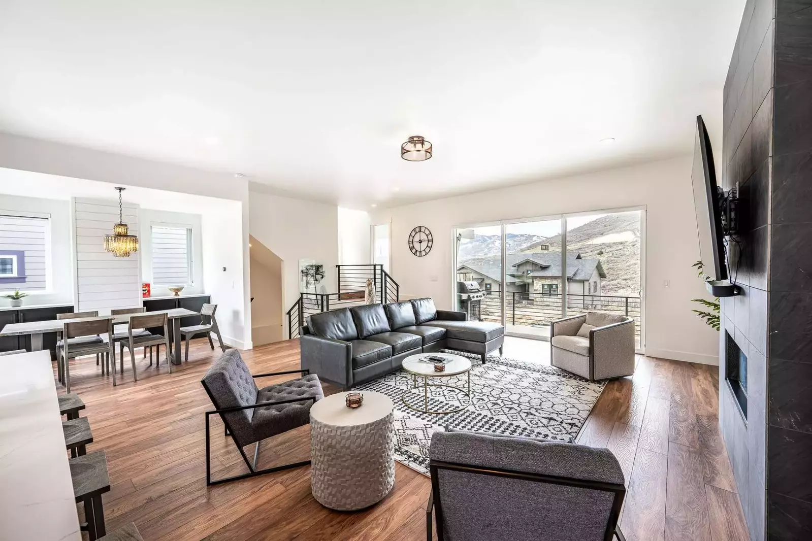 Guests will enjoy expansive views and are invited to relax on the comfortable furnishings next to the cozy gas fireplace