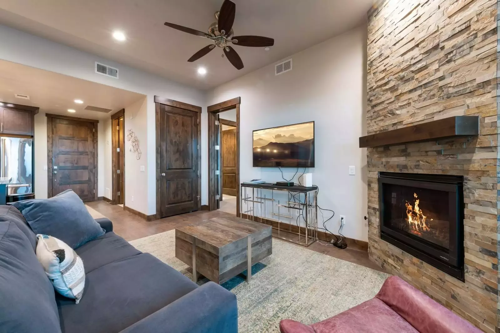 The family room is warm and inviting with a plush, sofa sofa, warm fireplace and smart HDTV w Xfinity Cable