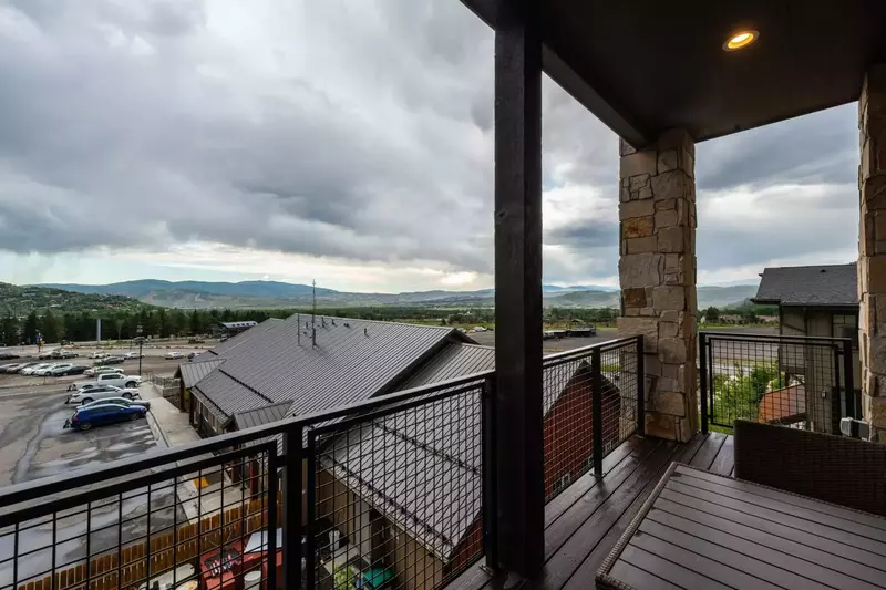 Private patio with gas grill and dining furniture