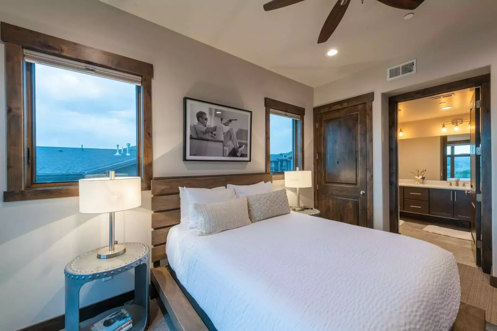The spacious primary suite has a spa-like bathroom connected to the bedroom area.