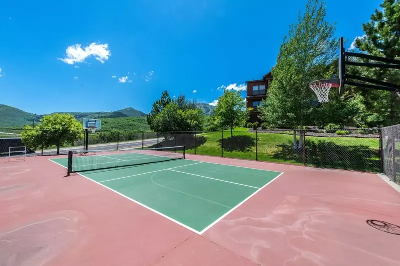 The community tennis court is just steps away from the home.