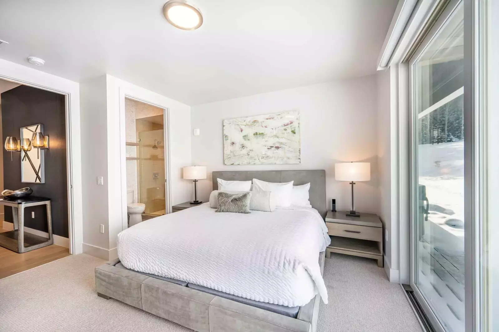 The first guest suite is located next to the entry and features a King size bed with high quality linens, smart HDTV and a spacious dresser for storag