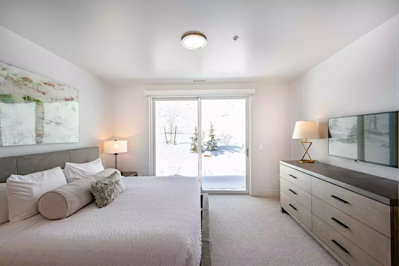 The first guest suite is located next to the entry and features a King size bed with high quality linens, smart HDTV and a spacious dresser for storag