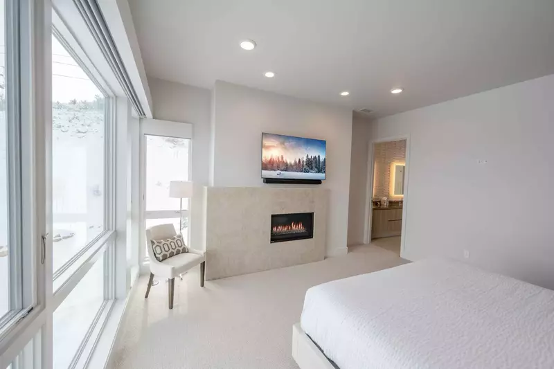 Luxe Primary Suite with King Bed, Gas Fireplace and Private Spa-like Bathroom. Keywords: Park City Ski-In Ski-Out, Luxury Park City Vacation Rental