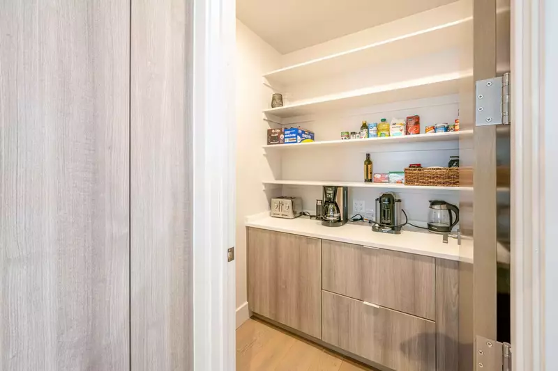 This is the walk-in pantry which has the keurig, traditional drip coffee maker, electric tea kettle and stainless steel 4-slice toaster