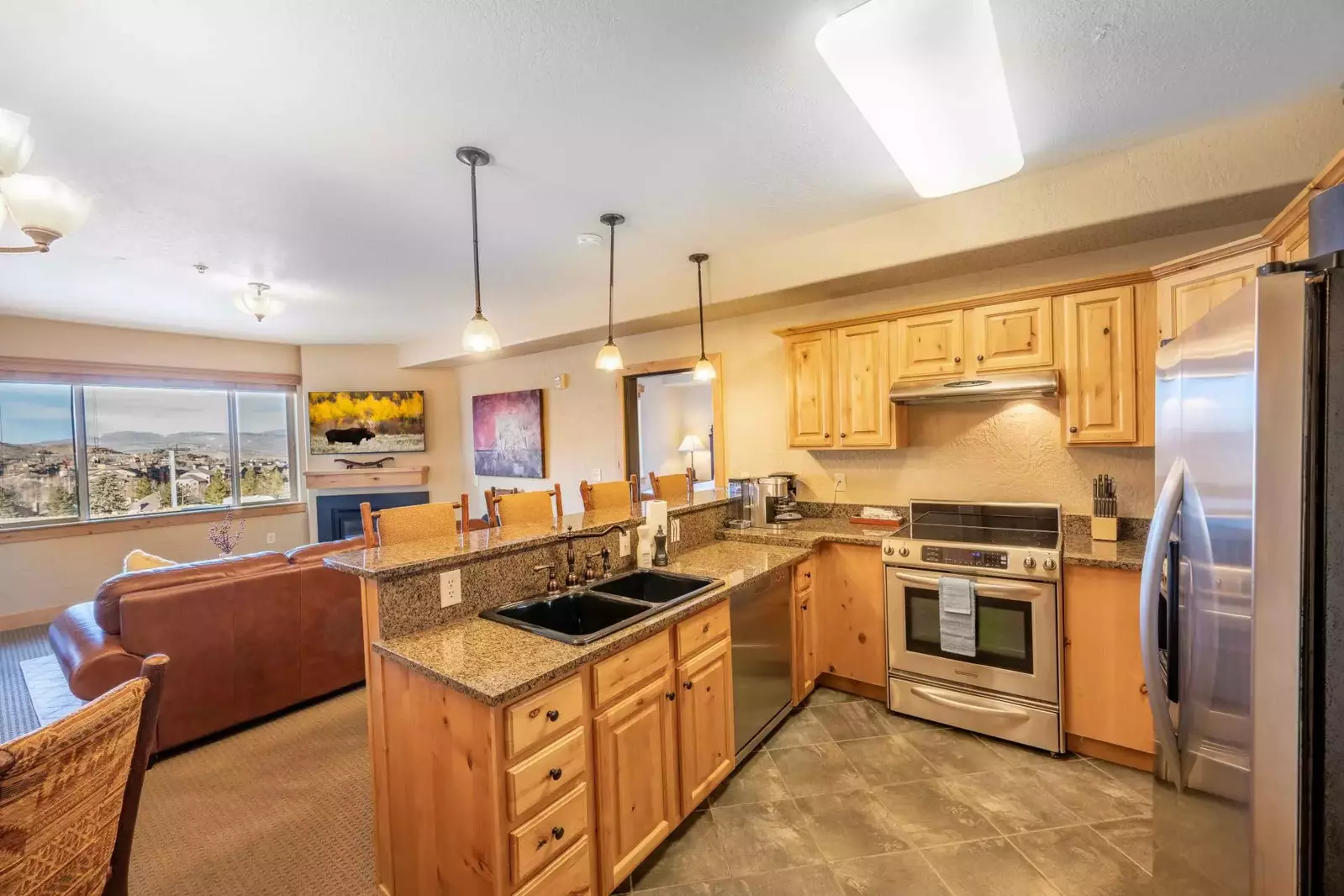 Enjoy Mountain Views from Our Bright & Spacious Updated Kitchen! The Fully Stocked Kitchen Features Full Size Stainless Steel Appliances as Well As Sm