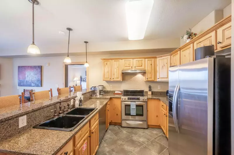 The fully stocked kitchen features full size stainless steel appliances as well as small appliances - including air fryer, keruig, blender, drip coffe
