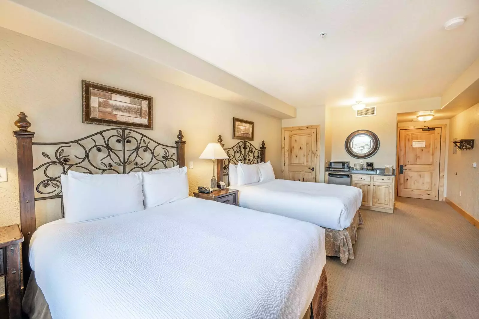 Guest suite with two plush queen beds, each outfitted with thigh quality, triple sheeting that is professionally laundered between each stay. Private