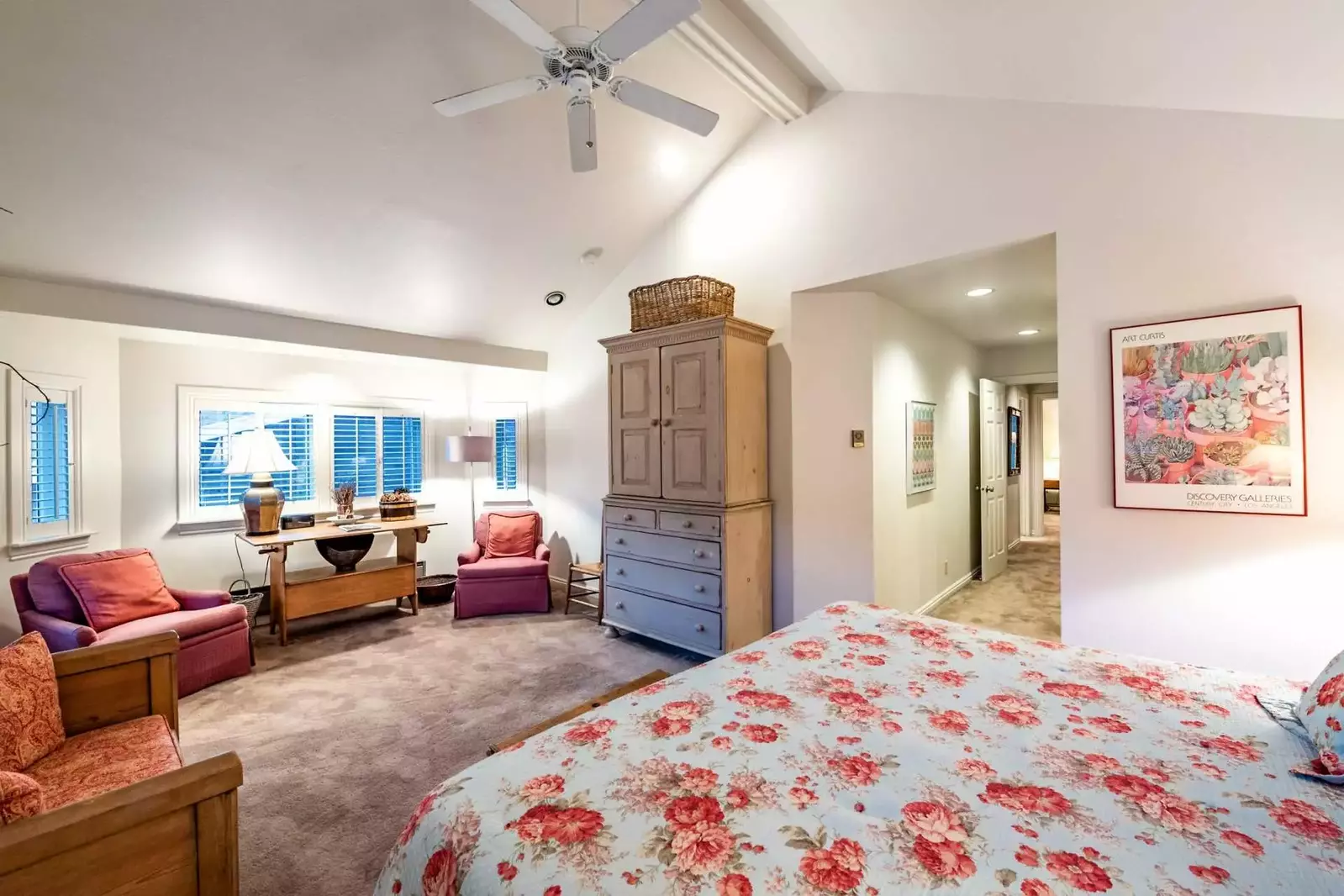 Master bedroom with king bed, lounge area and en suite bathroom.