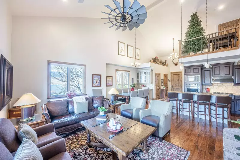 The open floor plan is perfect for gathering - this is the living room, which is located on the main floor. It features comfortable furniture, gas fir