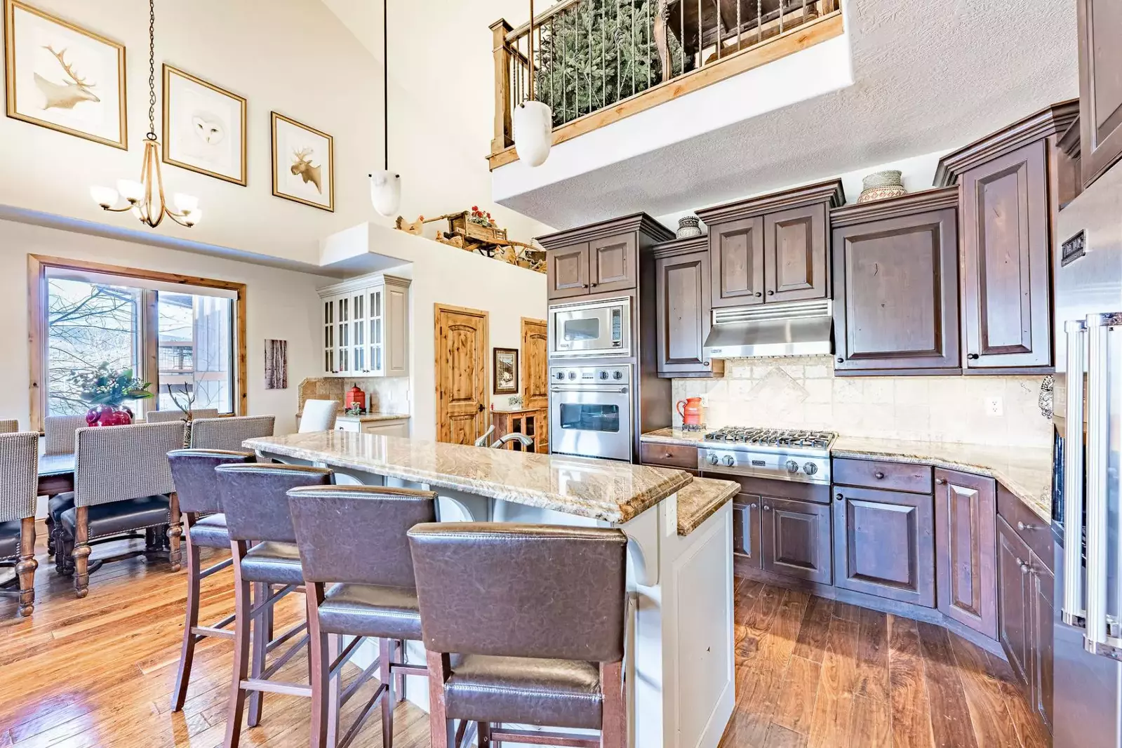 High End Chef's Kitchen w Viking appliances, Kitchen island w bar stool seating for 3 and opens up to the living and dining room.