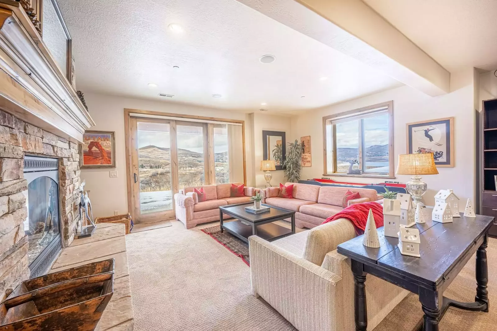 The lower level is filled with natural light and is perfect for gathering together! It features a second family room with a gas fireplace, shuffleboar