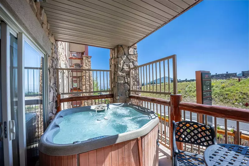 This Westgate 4 bedroom home has 2 patios, this one is located off the living room and has a private hot tub.