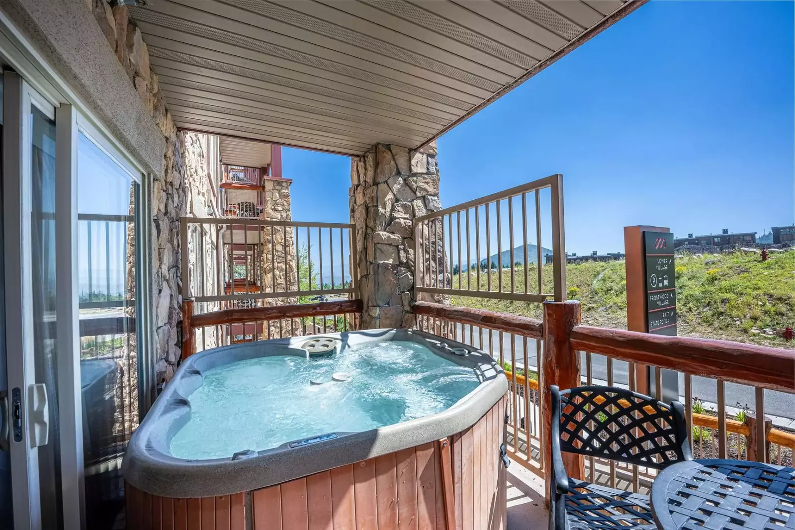 This Westgate 4 bedroom home has 2 patios, this one is located off the living room and has a private hot tub.