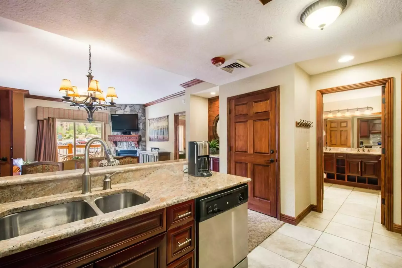 The gourmet chef’s kitchen boasts a full array of stainless steel appliances, high-end cabinetry, marble counters and cookware.