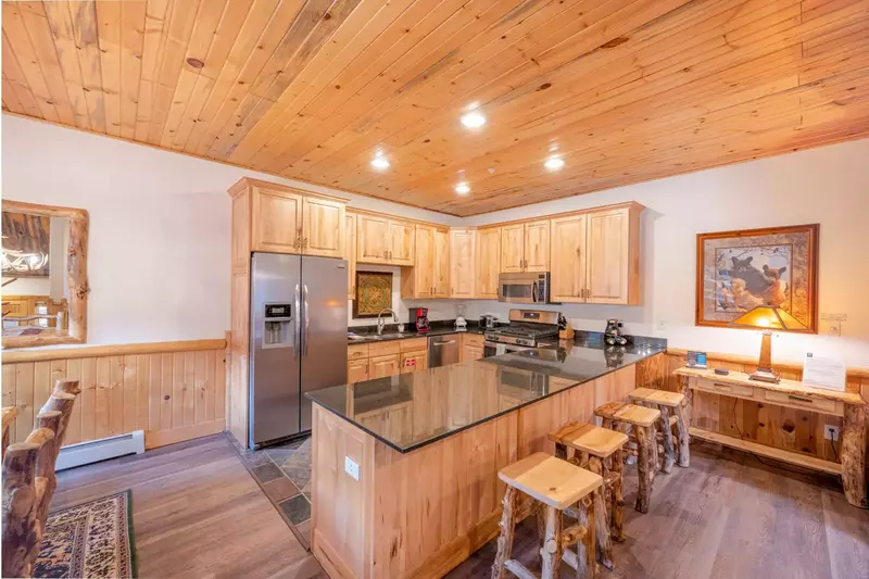 The home has an open concept floor plan has hardwood flooring throughout. The hardwood dining table can easily seat six (6). There are four additional