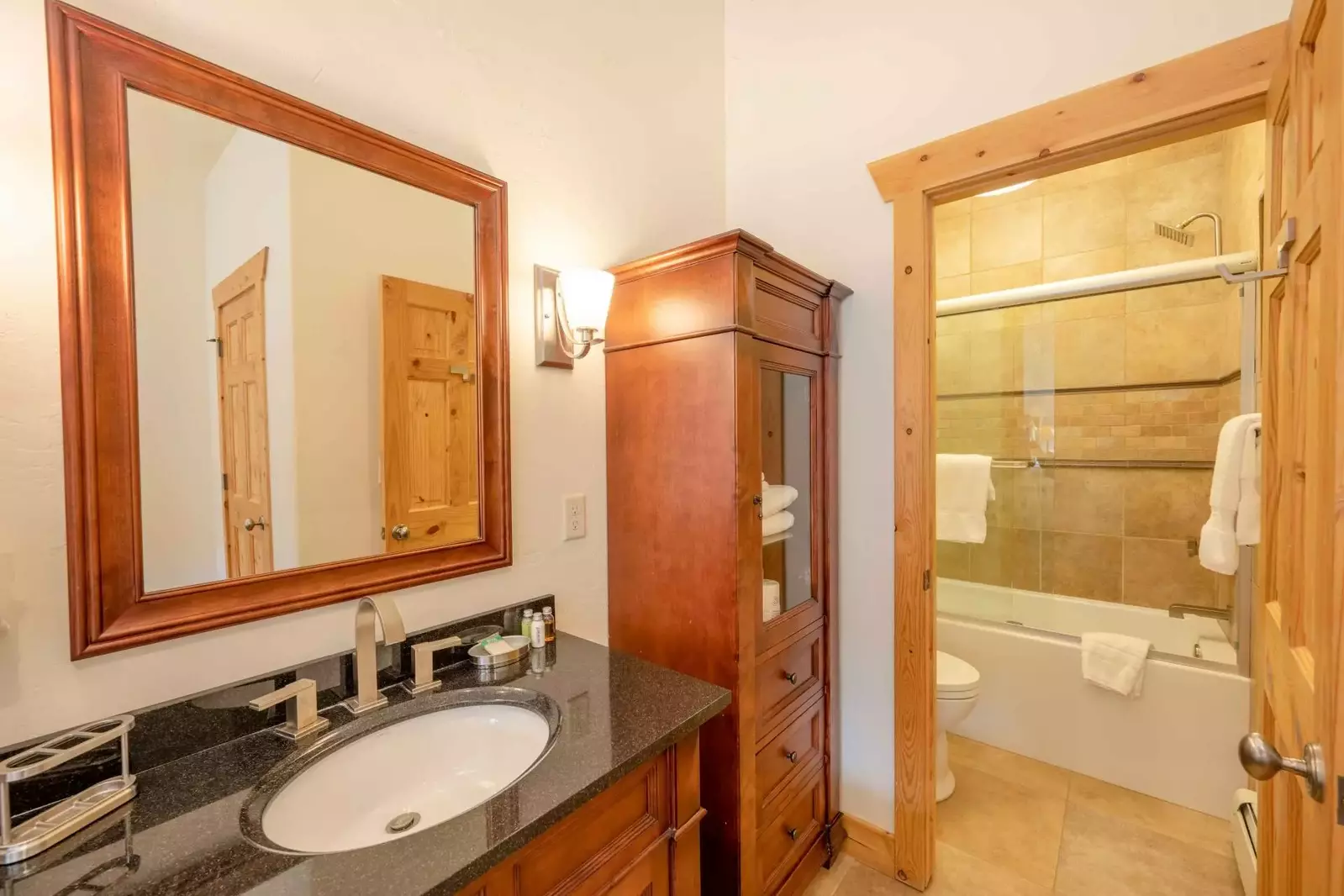 The spacious guest bathroom is exquisite in design and decor with high end furnishings and fixtures.