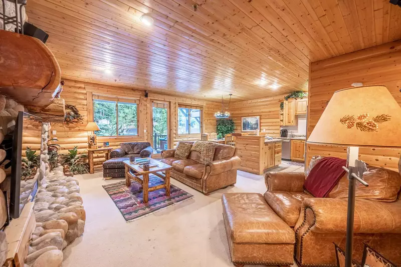 The Open Floor Plan Has a Dining & Living Area Which Flow Seamlessly, The Living Area Has a Leather Queen Sleeper Sofa, Stone Encased Gas fireplace, H