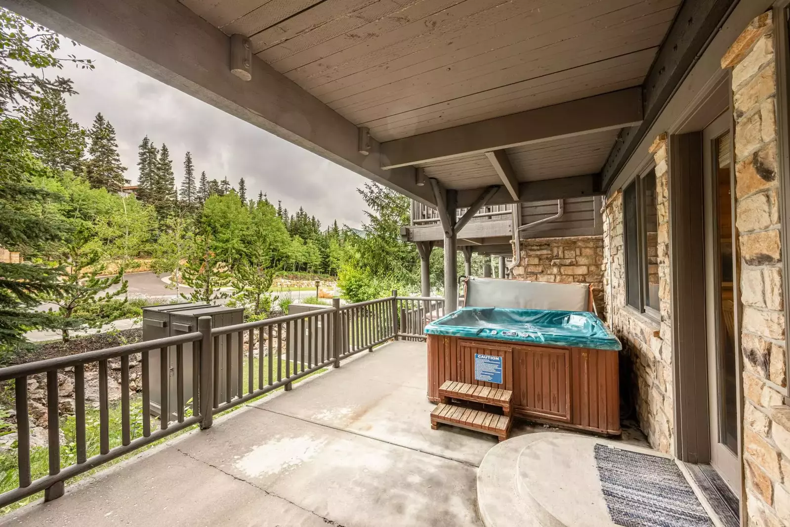 Enjoy the beautiful lake views from the large, private hot tub, located just outside the living area on a covered deck.