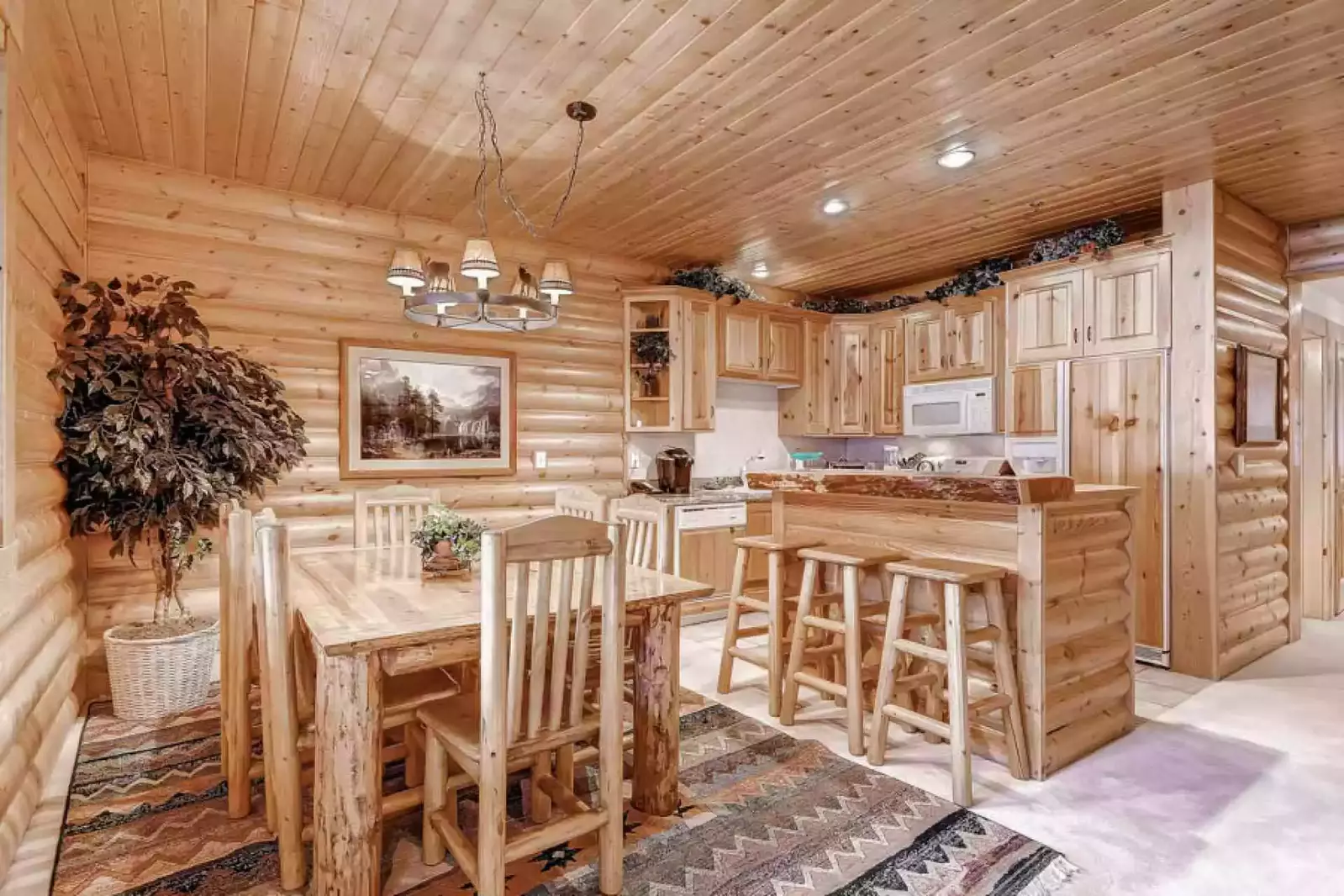 Large gourmet kitchen, fully-equipped with breakfast bar, fridge, oven, dishwasher, microwave, Keurig coffee maker. Large dining room seats six (6).