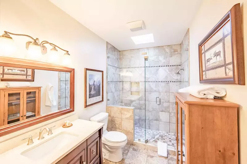Master bedroom (1) features a remodeled en suite bathroom - complete with high end finishes, fixtures and furnishings. Features an oversized stone til