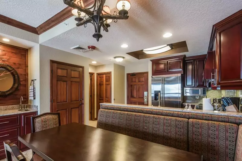 Hardwood Dining Table with Plenty of Seating, Bar with Sink & Drawers, Fully Stocked Kitchen