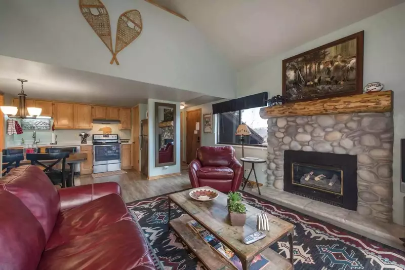 Welcome to our Red Pine Home! Just off the living room is a sliding glass door which has access to a private covered balcony with views of