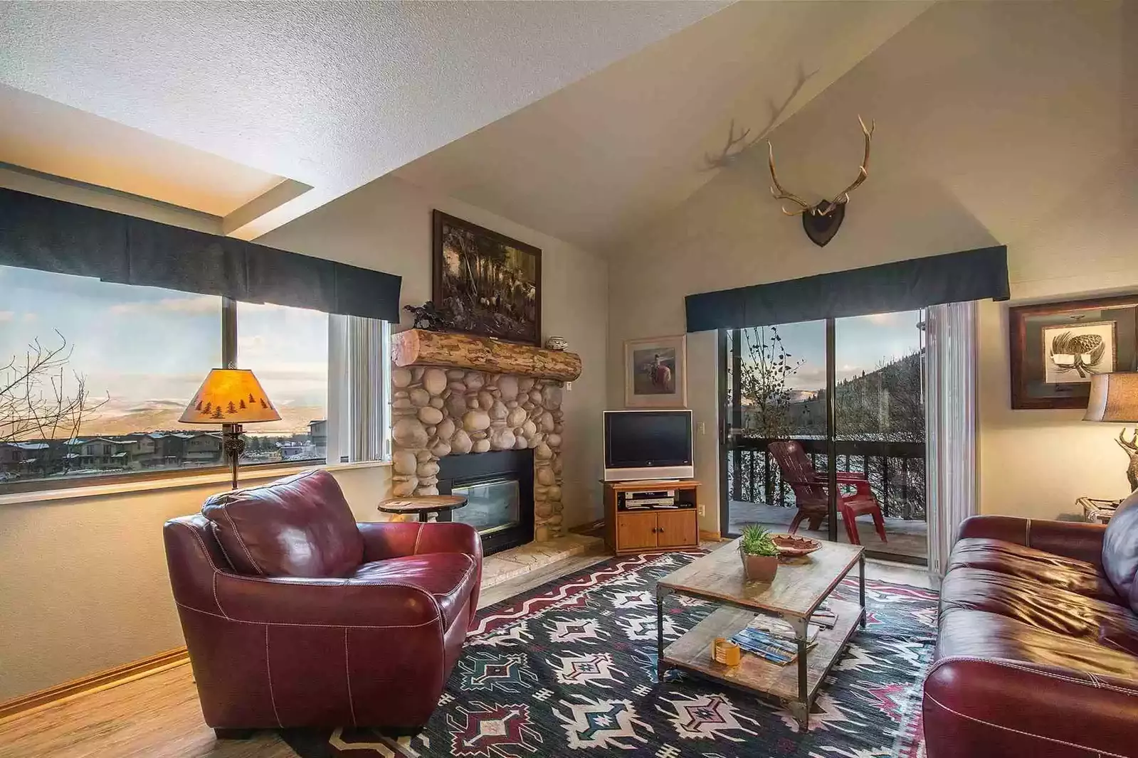 Welcome to Red Pine Winter Way! It features a spacious great room with a river rock decor fireplace, flatscreen TV and comfortable new furnishings.