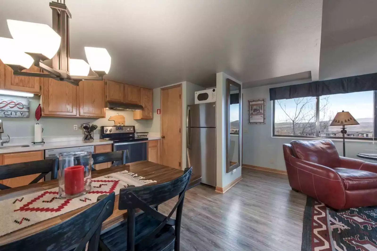 The classic mountain atmosphere has certainly remained with a unique river-rock fireplace, antler décor and other western features & finishings.