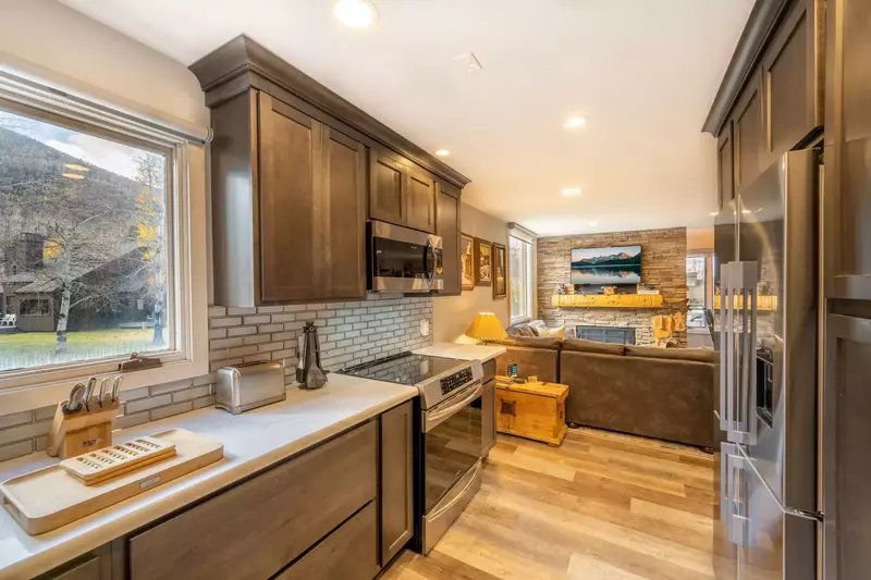 Our newly remodeled kitchen features all new stainless steel appliances including a new stainless french door fridge, new hardwood flooring, backsplas