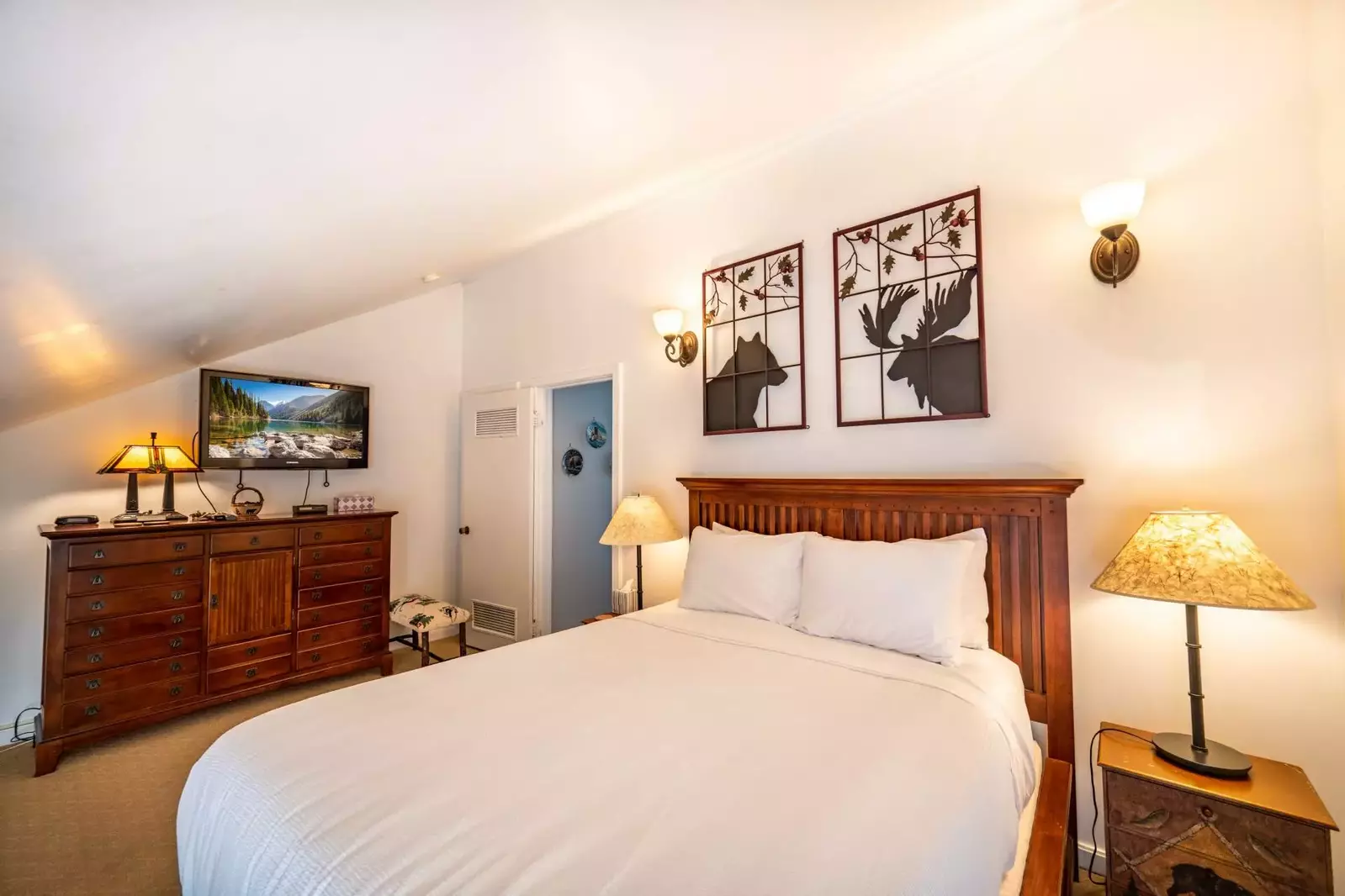 Guests can relax and enjoy the fresh, professionally laundered linens on the queen bed. There is a flat screen where guests can watch their favorite p
