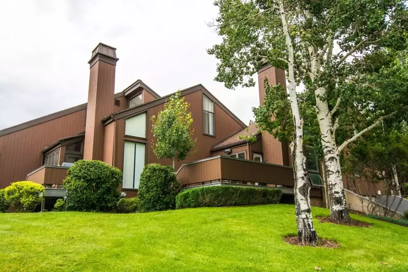 Our Home is on the left hand side of this photo. The private deck overlooks the golf course and has a Private Hot Tub & BBQ Grill